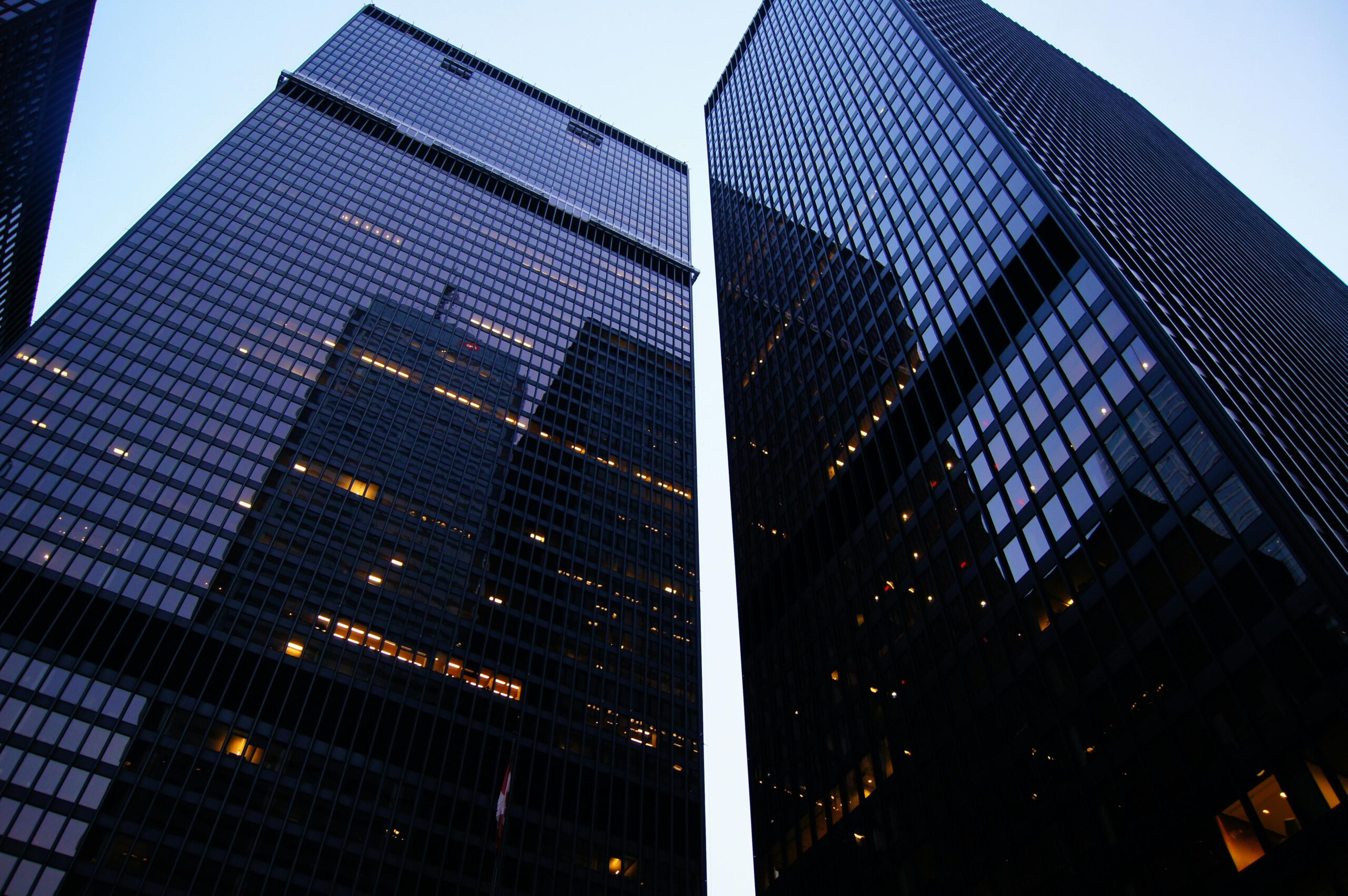 Dramatic low angle view of Toronto's skyscrapers reflecting the evening sky.